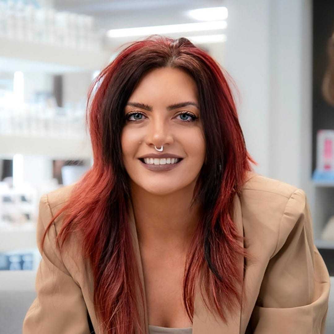 Portrait of Cassidy Bauer, a professional stylist at Studio Seven, showcasing their expertise and style.