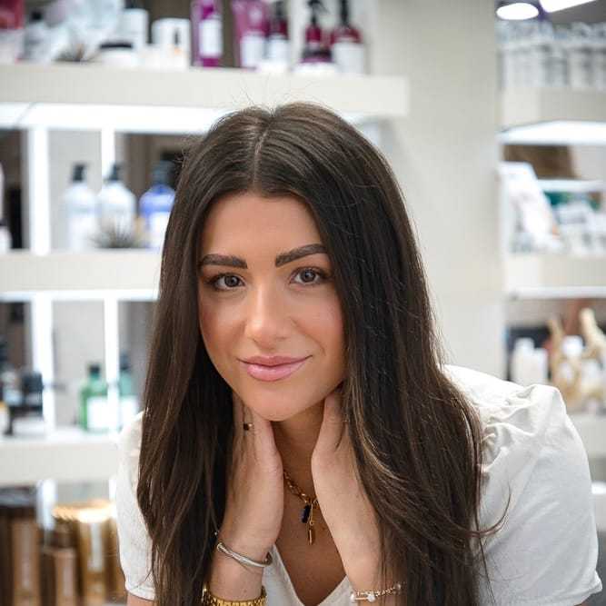 Portrait of Madi Morris, a professional stylist at Studio Seven, showcasing their expertise and style.