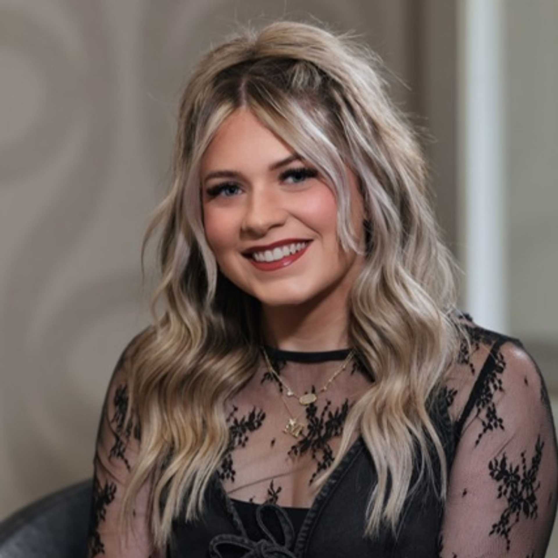 Portrait of Mikayla Dietrich, a professional stylist at Studio Seven, showcasing their expertise and style.