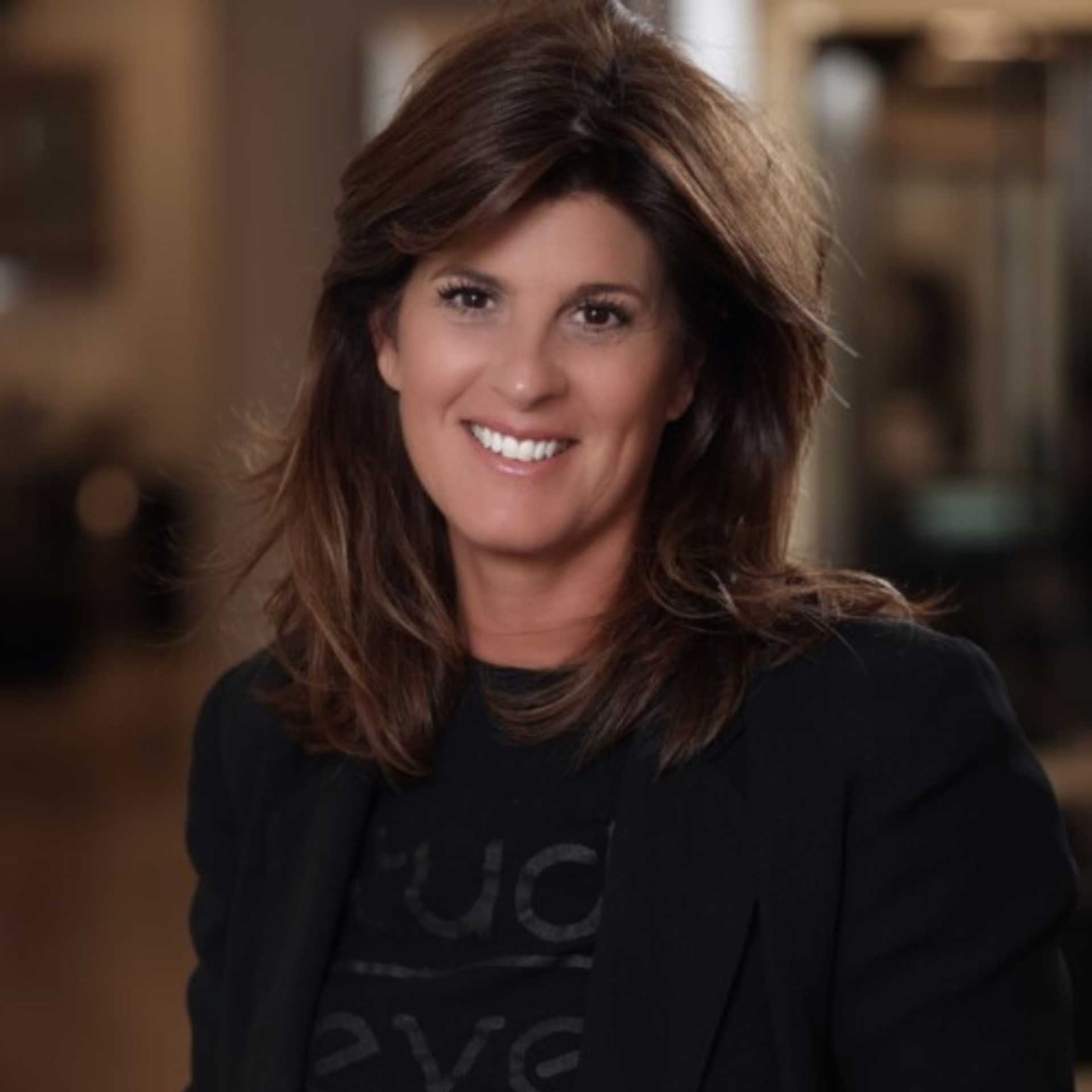 Portrait of Tracey DeBoer, a professional stylist at Studio Seven, showcasing their expertise and style.