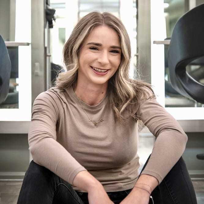 Portrait of Madison Provenzano, a professional stylist at Studio Seven, showcasing their expertise and style.