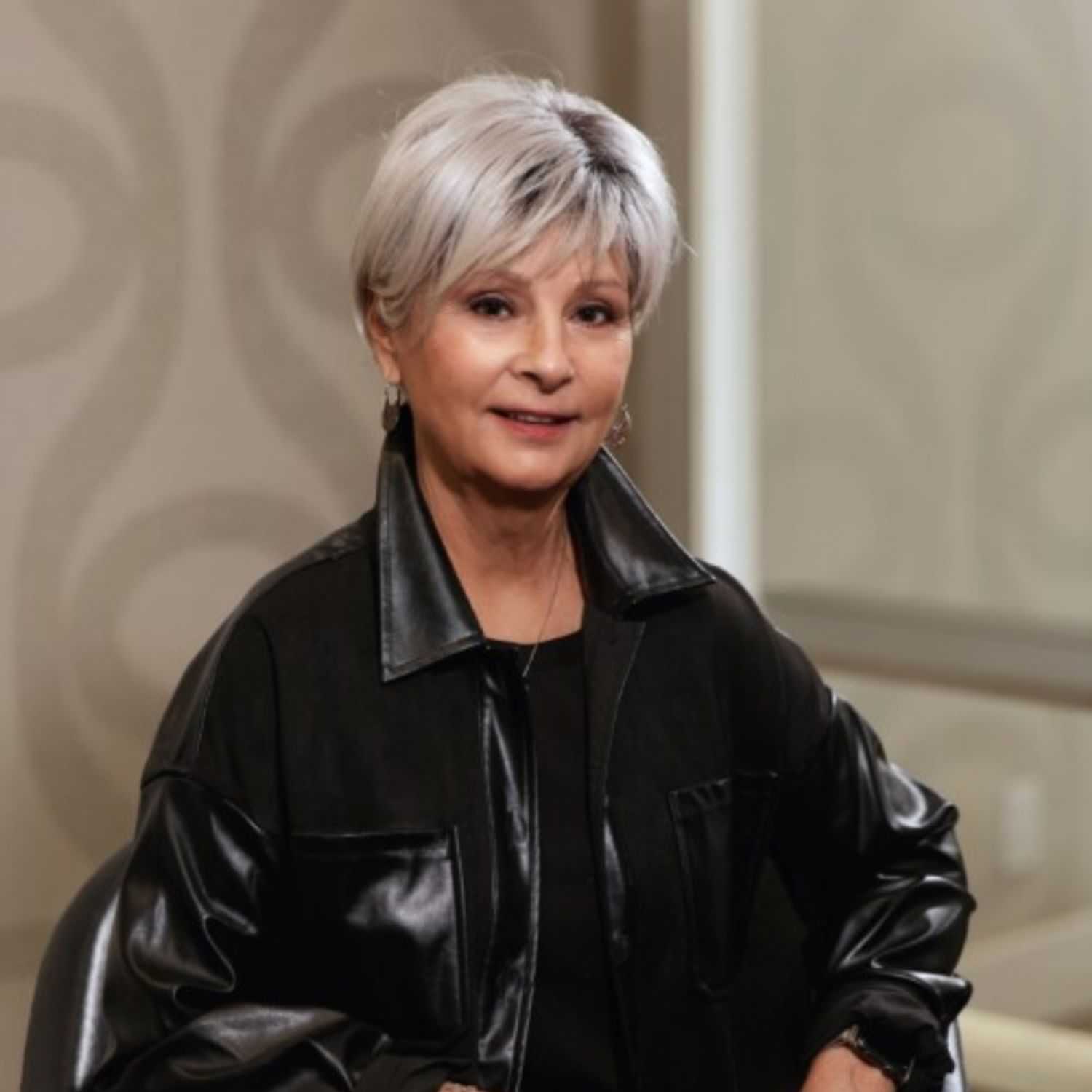 Portrait of Nancy Frazier, a professional stylist at Studio Seven, showcasing their expertise and style.