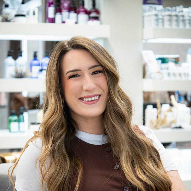 Portrait of Emily Belleville, a professional stylist at Studio Seven, showcasing their expertise and style.