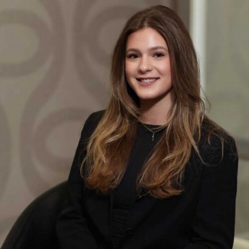 Portrait of Ava DeBoer, a professional stylist at Studio Seven, showcasing their expertise and style.