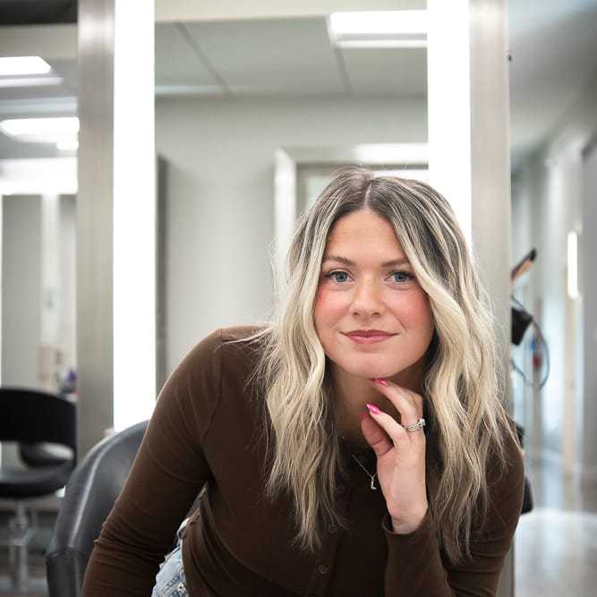 Portrait of Mikayla Dietrich, a professional stylist at Studio Seven, showcasing their expertise and style.