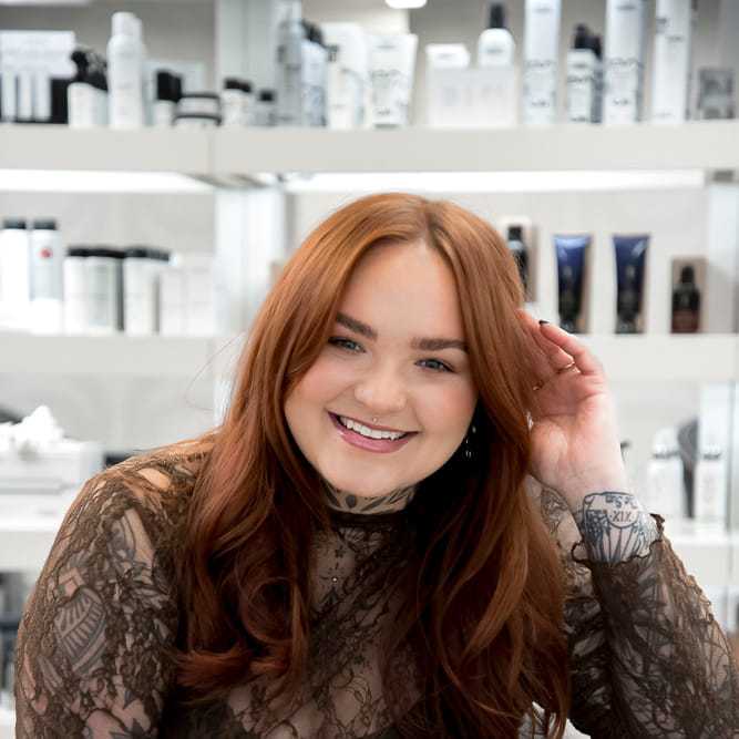 Portrait of Sophia Jennings, a professional stylist at Studio Seven, showcasing their expertise and style.