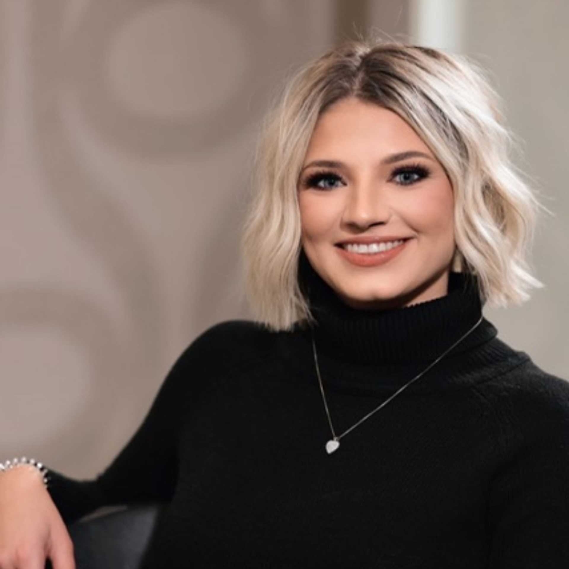 Portrait of Talia DeRenzo, a professional stylist at Studio Seven, showcasing their expertise and style.