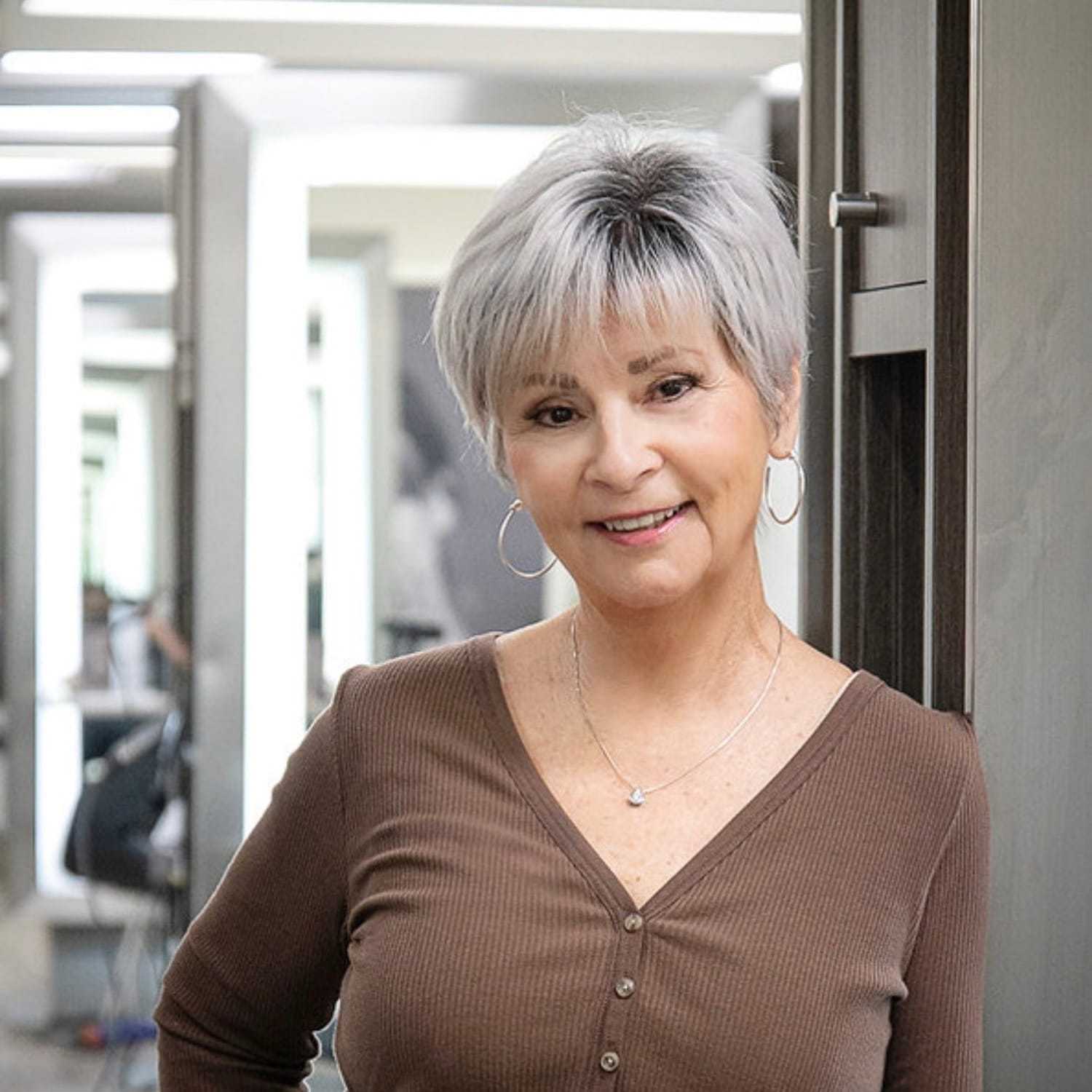 Portrait of Nancy Frazier, a professional stylist at Studio Seven, showcasing their expertise and style.