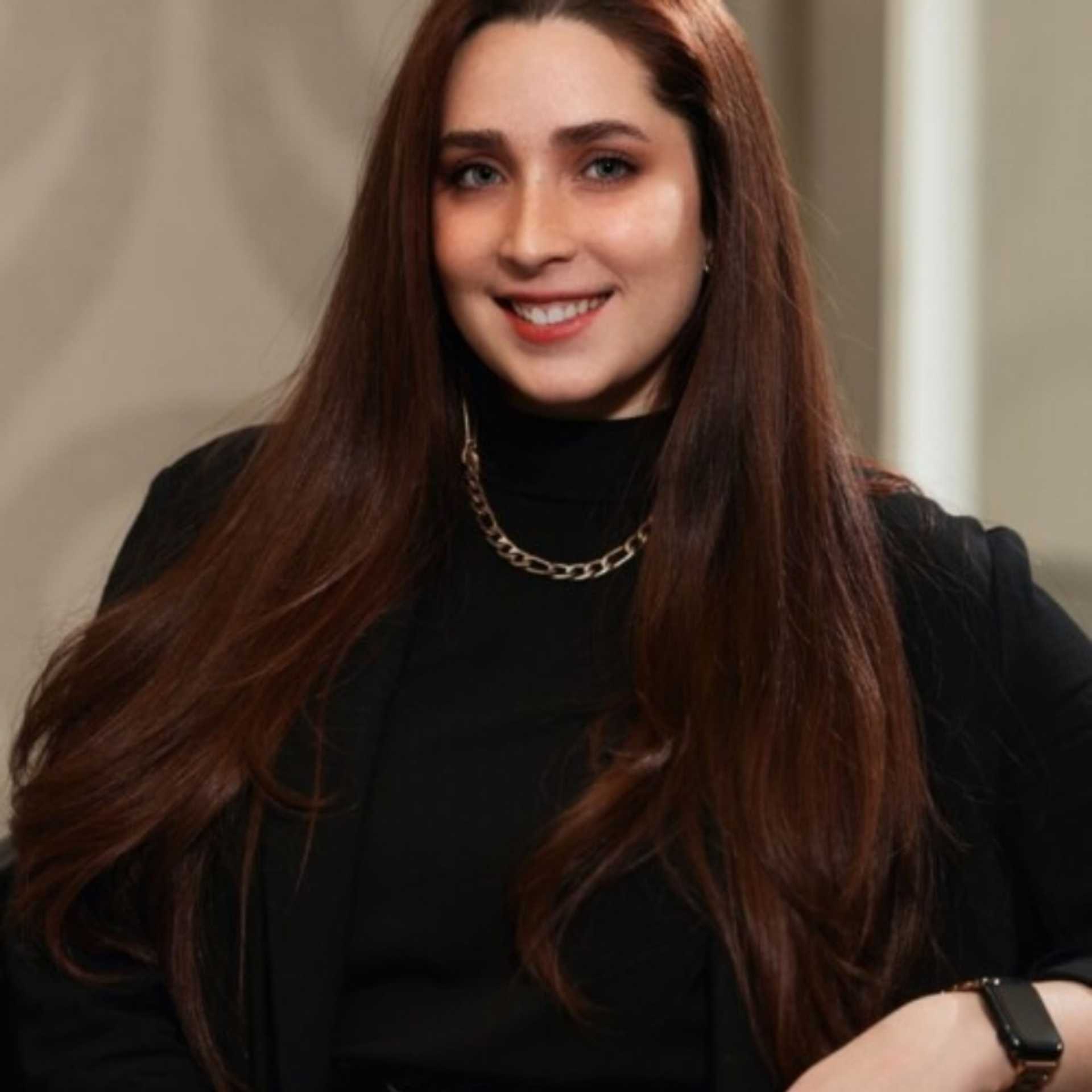 Portrait of Heather Craig, a professional stylist at Studio Seven, showcasing their expertise and style.