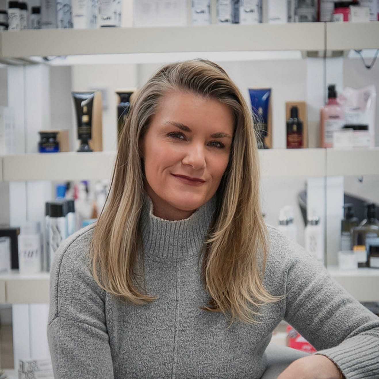 Portrait of Amy Neel, a professional stylist at Studio Seven, showcasing their expertise and style.