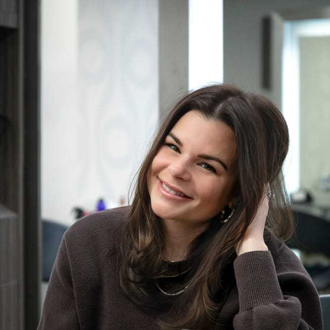Portrait of Jill Verbosky, a professional stylist at Studio Seven, showcasing their expertise and style.