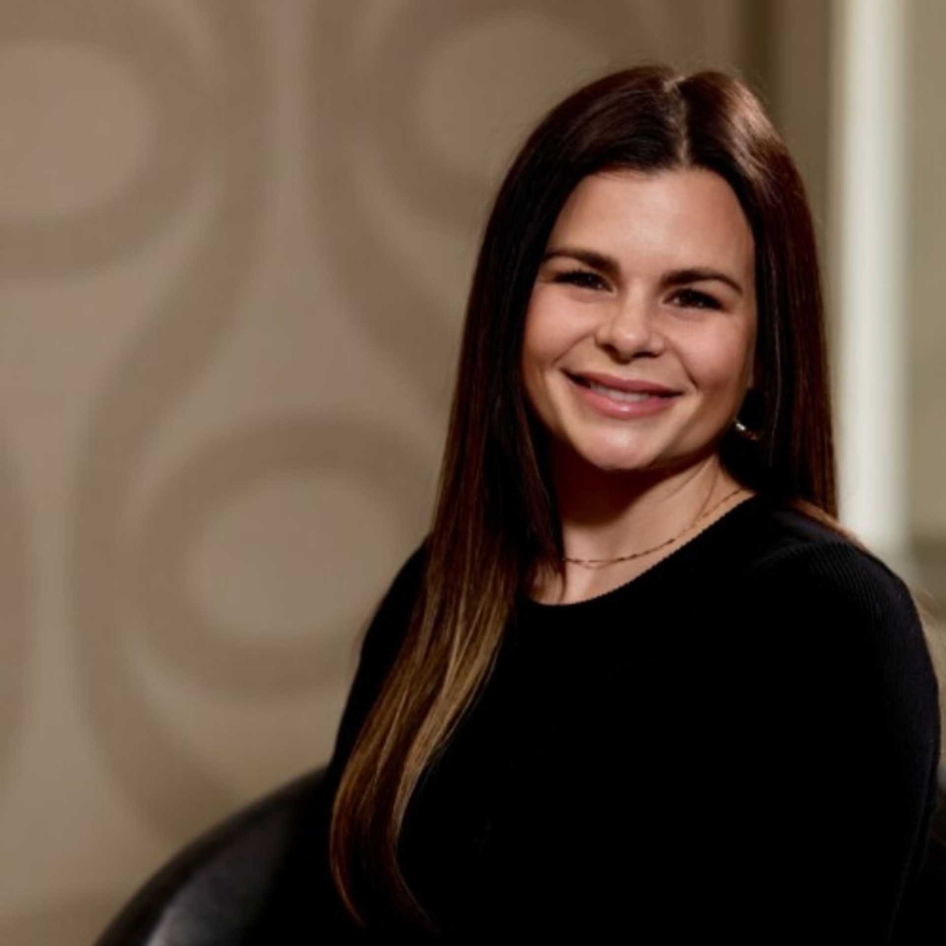 Portrait of Jill Verbosky, a professional stylist at Studio Seven, showcasing their expertise and style.