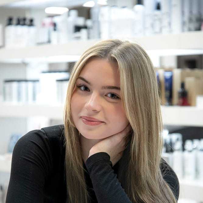 Portrait of Logan Marklewitz, a professional stylist at Studio Seven, showcasing their expertise and style.