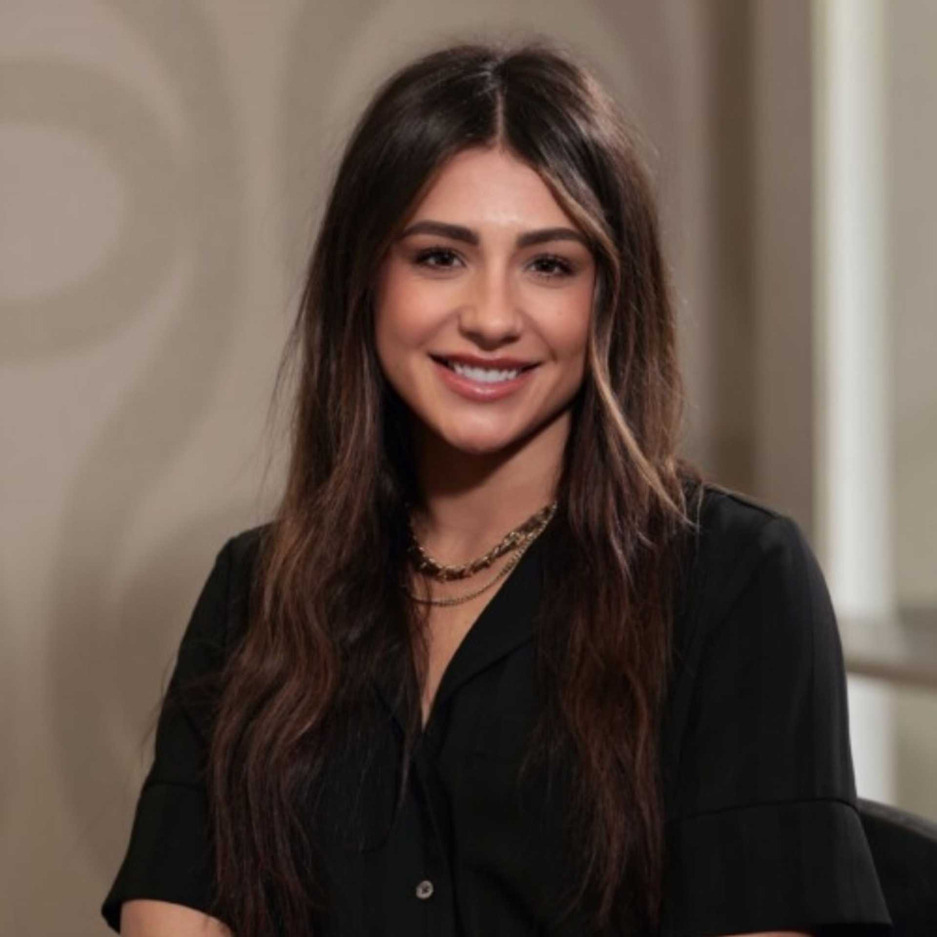 Portrait of Madi Morris, a professional stylist at Studio Seven, showcasing their expertise and style.