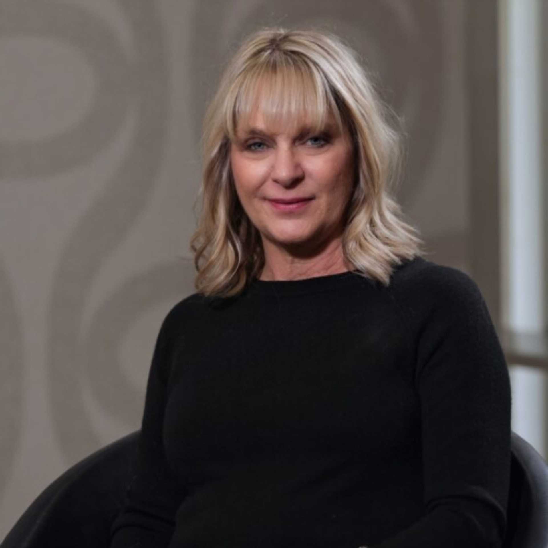 Portrait of Jodi Pliska, a professional stylist at Studio Seven, showcasing their expertise and style.