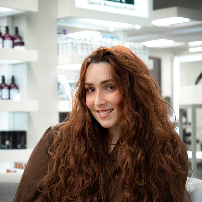 Portrait of Heather Craig, a professional stylist at Studio Seven, showcasing their expertise and style.