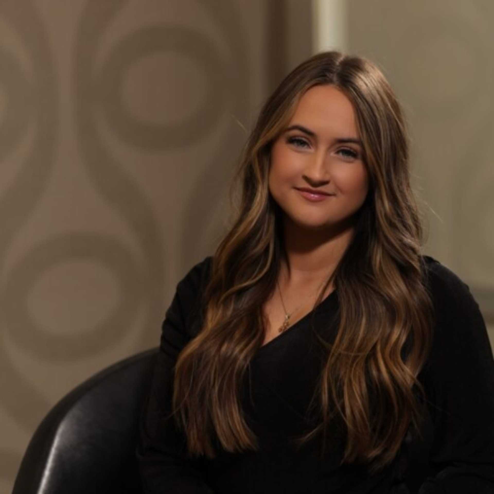 Portrait of Darianne James, a professional stylist at Studio Seven, showcasing their expertise and style.