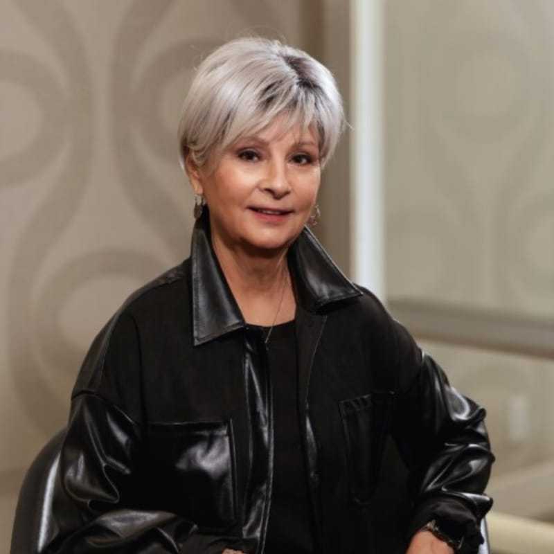 Portrait of Nancy Frazier, a professional stylist at Studio Seven, showcasing their expertise and style.