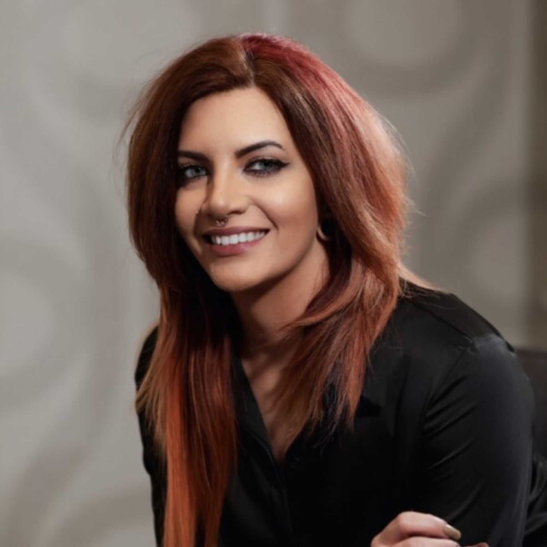 Portrait of Cassidy Bauer, a professional stylist at Studio Seven, showcasing their expertise and style.