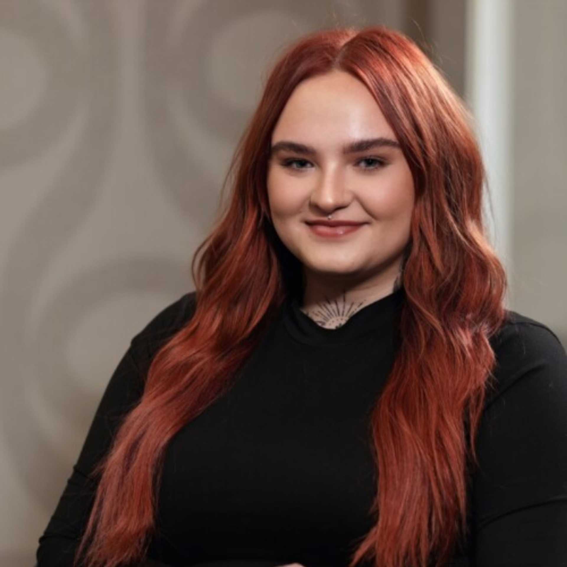 Portrait of Sophia Jennings, a professional stylist at Studio Seven, showcasing their expertise and style.